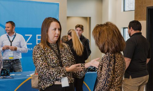 Two Business Women Chatting at a RizeX Event